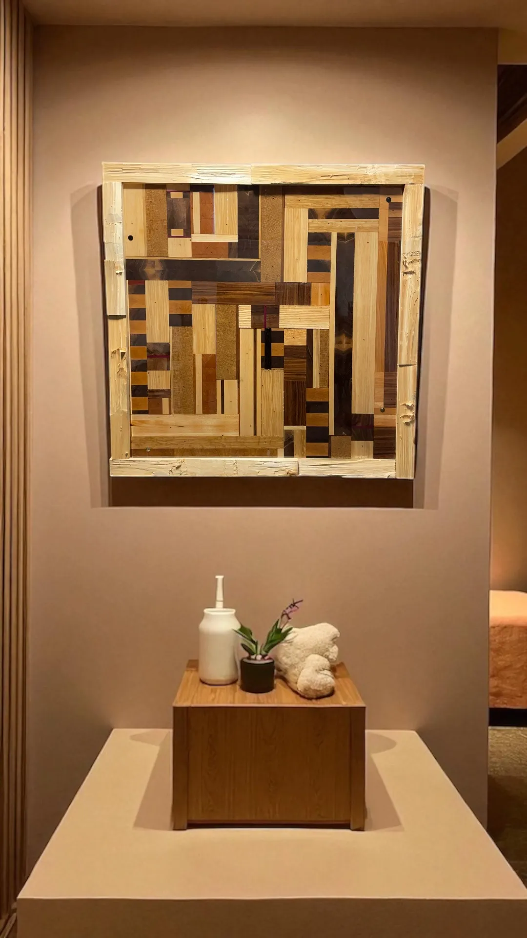 Minimalist sculpture artwork with clean lines and neutral tones. Textured surfaces with dramatic lighting. No human shapes.