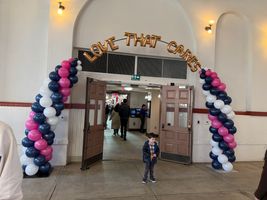 Spiral Arch with 16" Letters Love That Cares