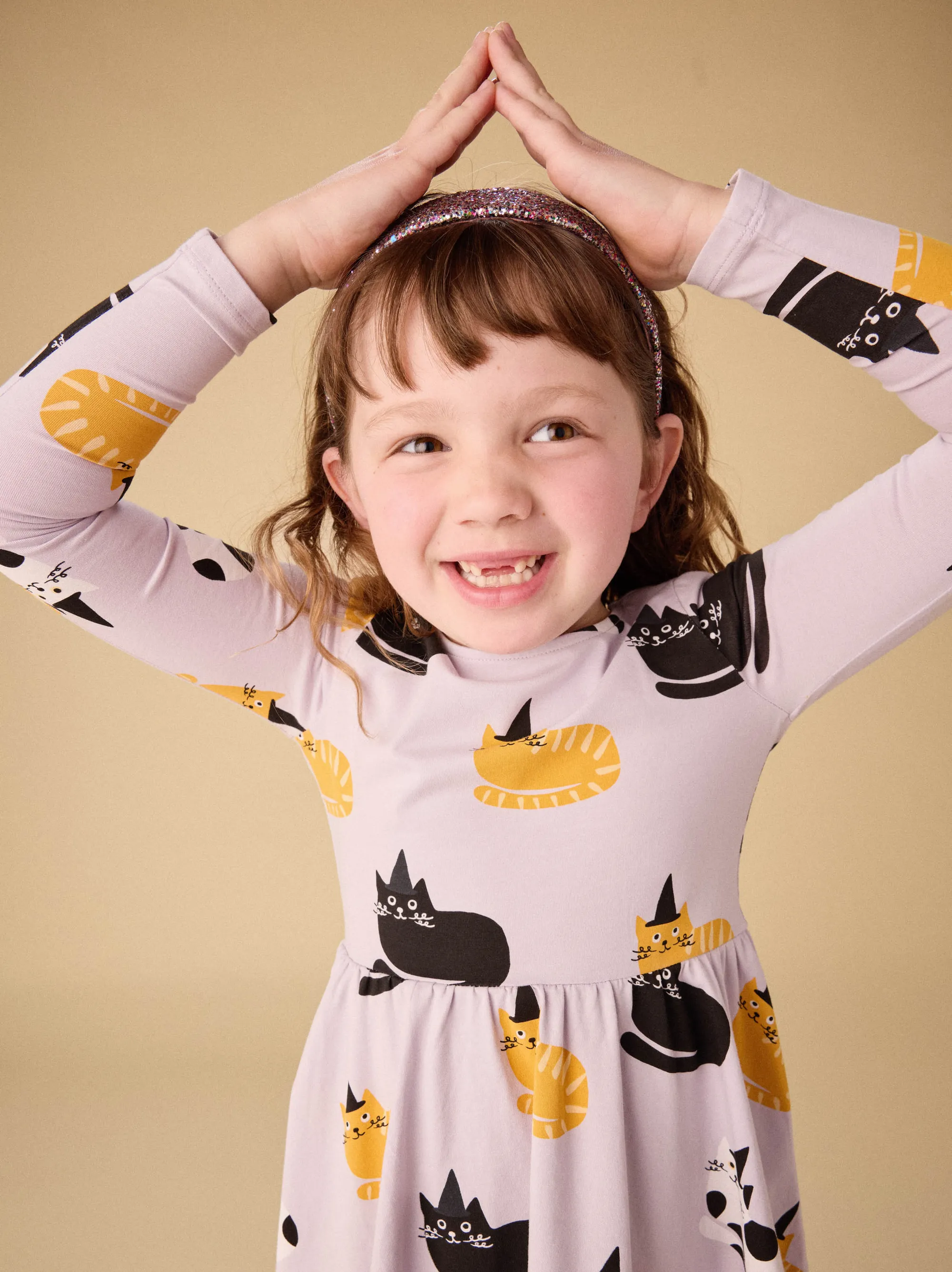 Colorful children's t-shirts with fun animal designs including panda, fox, and owl prints. No human figures.