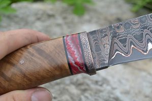 mammoth tooth spacer on knifehand