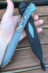 mammoth tooth stabilzied on knifehandl