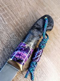 mammoth tooth stabilized purple spacer on knifehand bead