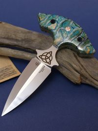 turquos mammoth tooth on knifehand