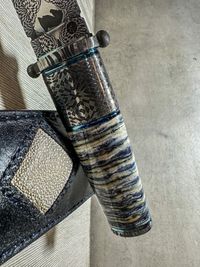 stabilized mammot tooth on knife