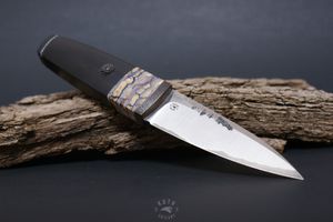 mammoth tooth spacer block on knifehand