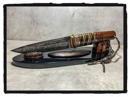 mammoth tooth stabilized on knifehand