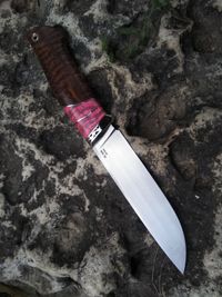 stabilized mammoth tooth spacer on knifehandl