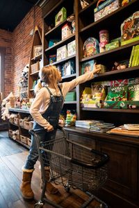 Girl browsing bookshelf