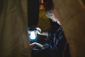 Boy playing with lantern