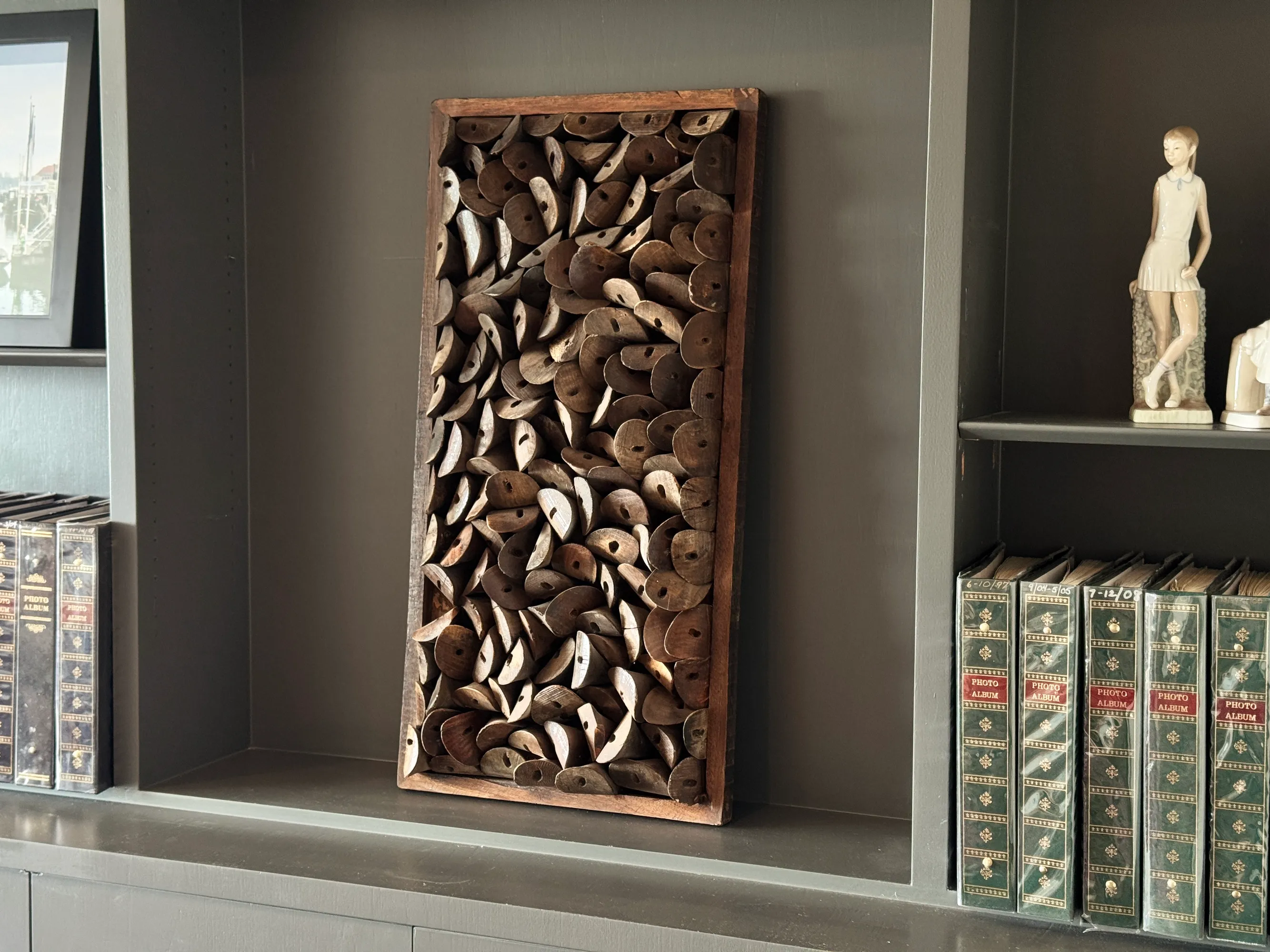 Close-up detail of furniture showing natural wood texture and woven elements. No human shapes.