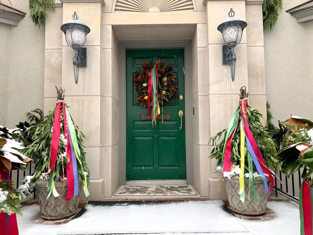 Festive holiday decoration with elegant ornaments, greenery, and warm lighting creating a cozy atmosphere. No human shapes.