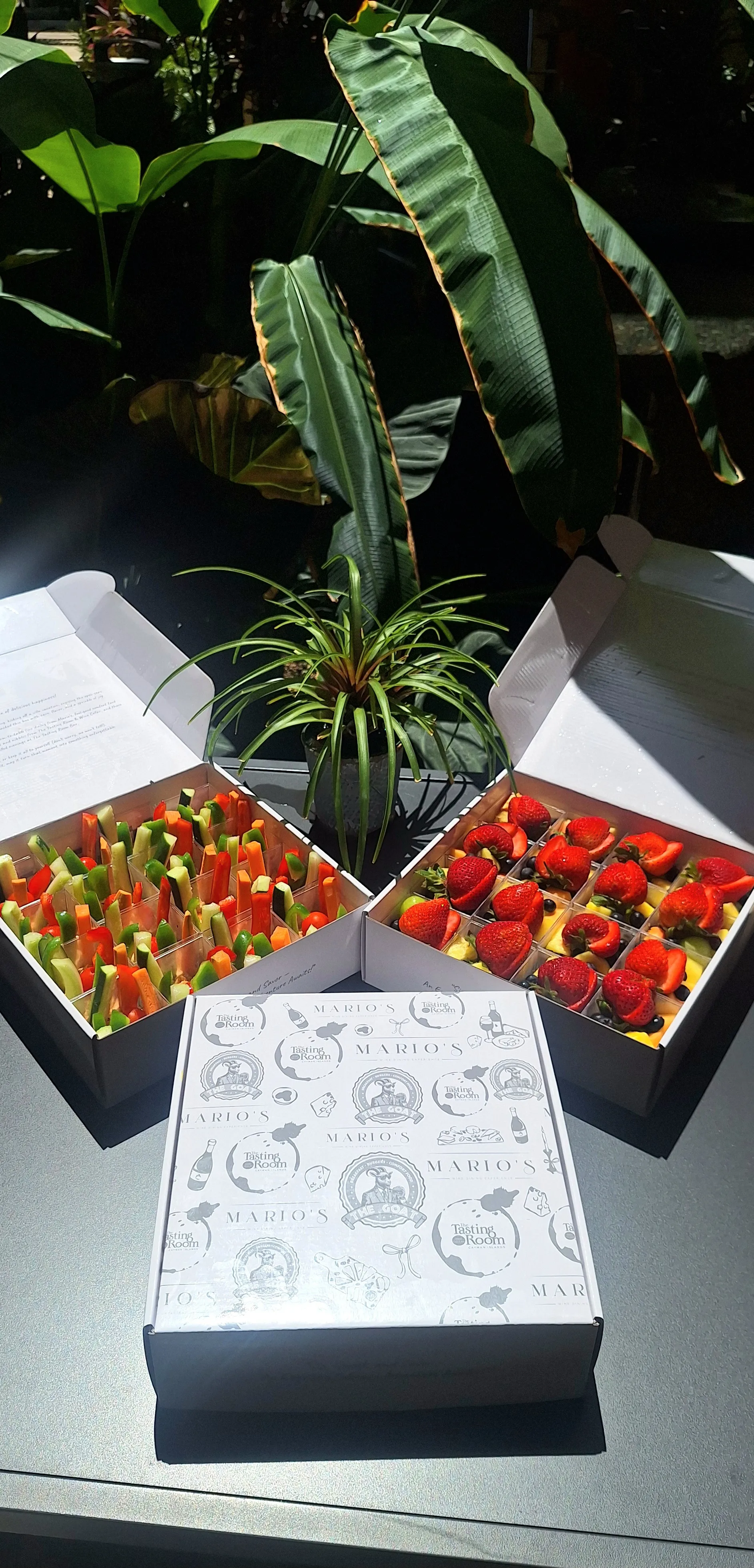 Vegetable and fruit cups beside our branded grazing box