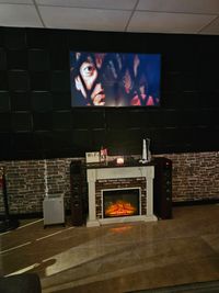Lounge entertainment area with TV and fireplace at Dallas Vape Delivery & Lounge