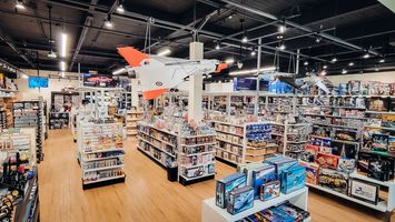 A picture of BC Hobbies store with lots of amazing hobby products on shelves!