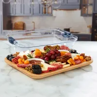 Bamboo charcuterie tray with lid on marble counter