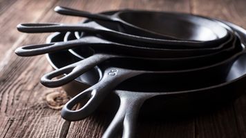 Stacked cast iron skillets.