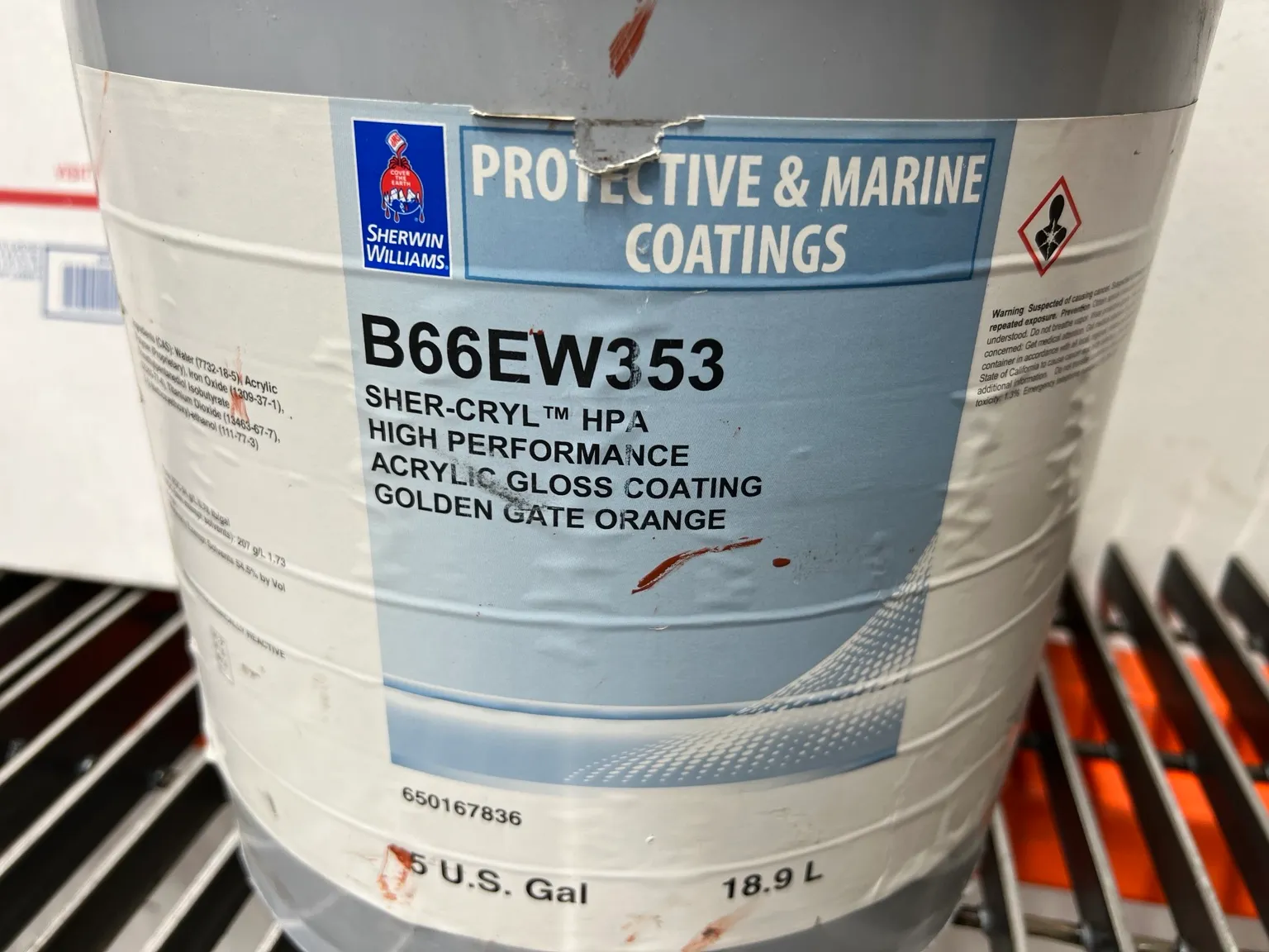 Our Sherwin-Williams paint bucket labeled Sher-Cryl HPA high performance acrylic gloss coating, Golden Gate Orange
