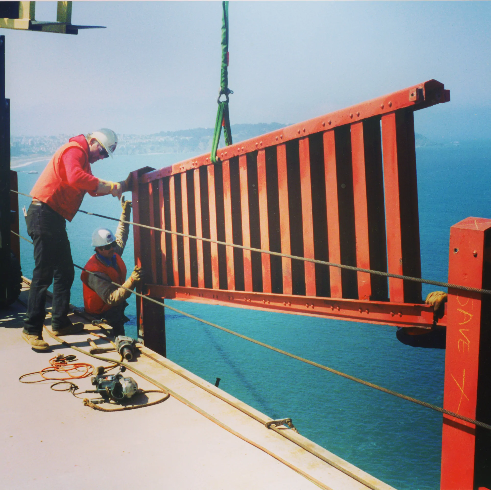 Original handrail being lifted from the bridge.