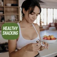 Fit woman enjoying snack bar at home with Healthy Snacking text, highlighting a selection of supplements for nutritious on-the-go snacks.