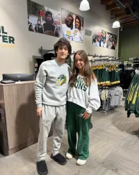 A boy and a girl posing.