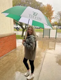 A girl with an umbrella.
