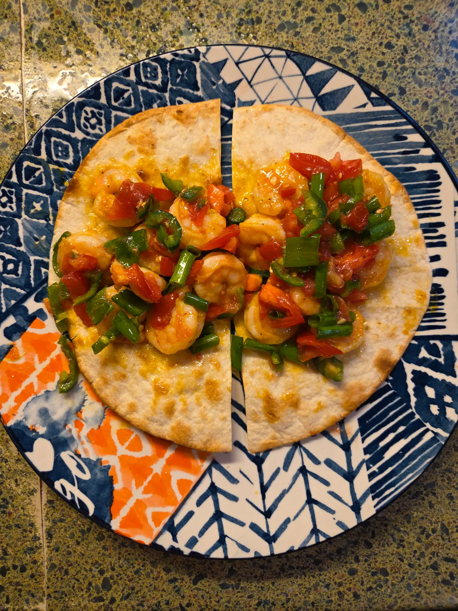 Plated crispy shrimp tacos with Sweet Heat bottle. The image shows perfectly crisp tortillas filled with sautéed shrimp that have been coated in Hoppy Sweet Heat sauce. The tacos are garnished with fresh diced tomatoes and jalapeños, with a bottle of Hoppy Sweet Heat sauce displayed beside the plate. Do not generate human shapes.